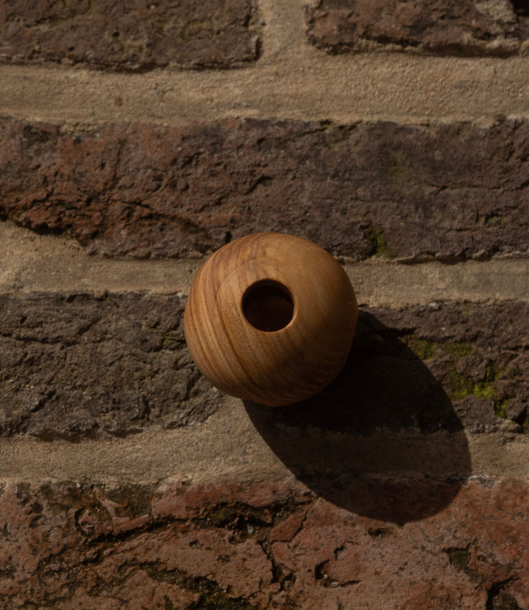 Houten Gatenbal Rammelaar