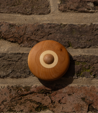 Houten rammelschijf